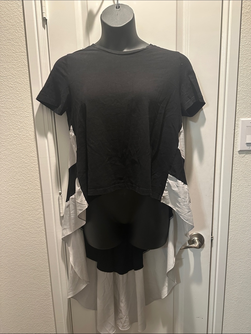 AKIRA Black Short Sleeve High-Low Tee with White Ruffle Panels